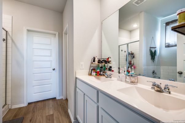 Bathroom, Dual Sink Vanities, Glass Shower, Interior, Recessed Lighting, Wood Texture Flooring