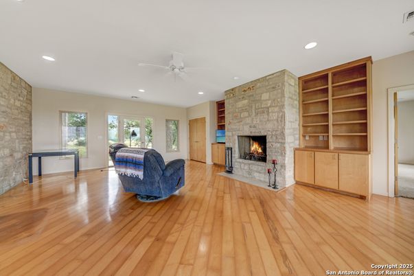 Fireplace, Interior, Recessed Lighting, Stone Walls, Wood Texture Flooring