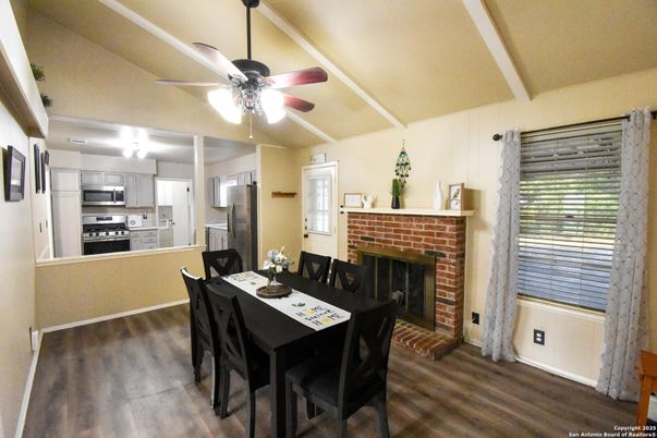 Dining room, Fireplace, Interior, Kitchen, Stainless Steel Appliances, Wood Texture Flooring
