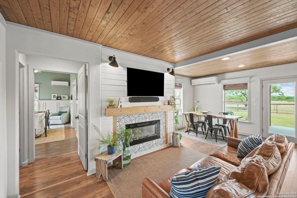 Dining room, Fireplace, Interior, Living room, Recessed Lighting, Wooden Ceilings, Wood Texture Flooring
