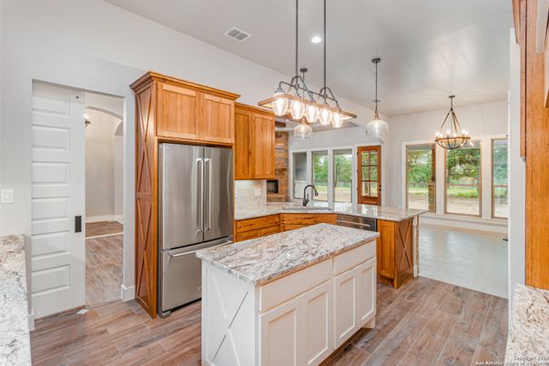 Chandelier, Interior, Kitchen, Pendant Lights, Recessed Lighting, Stainless Steel Appliances, Wood Texture Flooring
