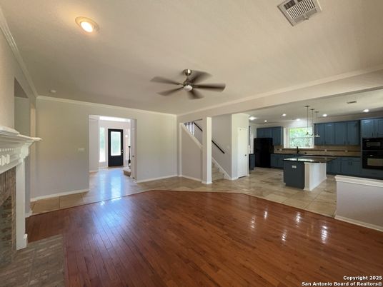 Empty room, Fireplace, Interior, Kitchen, Pendant Lights, Recessed Lighting, Wood Texture Flooring