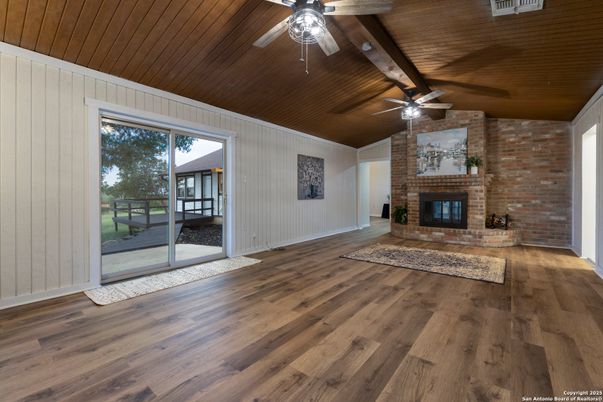 Empty room, Fireplace, Interior, Stone Walls, Wooden Ceilings, Wood Texture Flooring