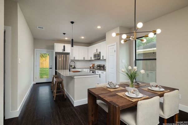 Dining room, Interior, Kitchen, Pendant Lights, Recessed Lighting, Stainless Steel Appliances, Wood Texture Flooring