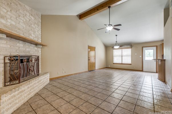 Empty room, Fireplace, Interior, Pendant Lights, Stone Walls, Wooden Beams