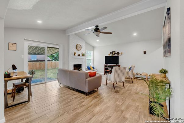 Fireplace, Interior, Living room, Recessed Lighting, Stone Walls, Wood Texture Flooring