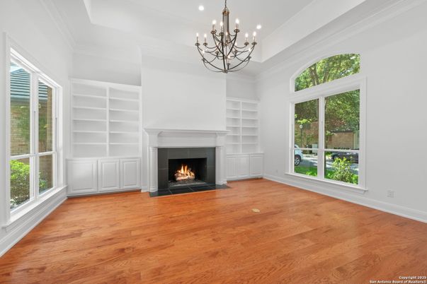 Chandelier, Empty room, Fireplace, Interior, Recessed Lighting, Wood Texture Flooring