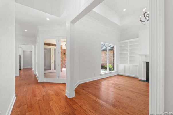 Chandelier, Empty room, Fireplace, Interior, Recessed Lighting, Wood Texture Flooring