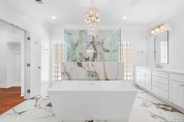 Bathroom, Chandelier, Free Standing Baths, Interior, Marble, Marble Walls, Recessed Lighting, Wood Texture Flooring