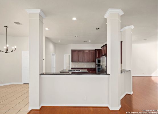 Chandelier, Interior, Kitchen, Pendant Lights, Recessed Lighting, Stainless Steel Appliances, Wood Texture Flooring