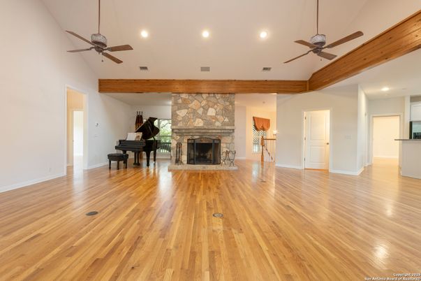 Fireplace, Interior, Piano, Recessed Lighting, Stone Walls, Wood Texture Flooring