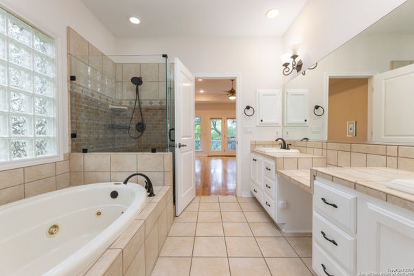 Bathroom, Dual Sink Vanities, Glass Shower, Interior, Recessed Lighting, Tile Countertops