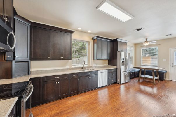 Dining room, Interior, Kitchen, Recessed Lighting, Stainless Steel Appliances, Wood Texture Flooring