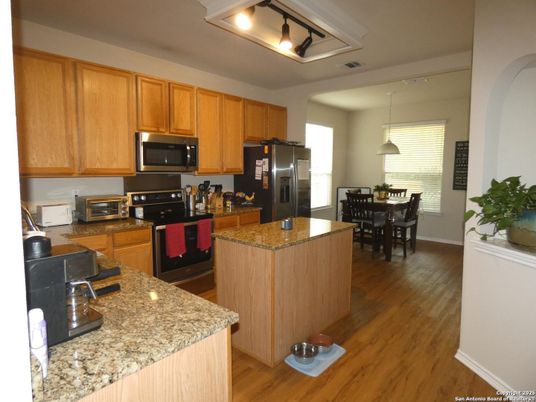 Dining room, Interior, Kitchen, Pendant Lights, Stainless Steel Appliances, Wood Texture Flooring