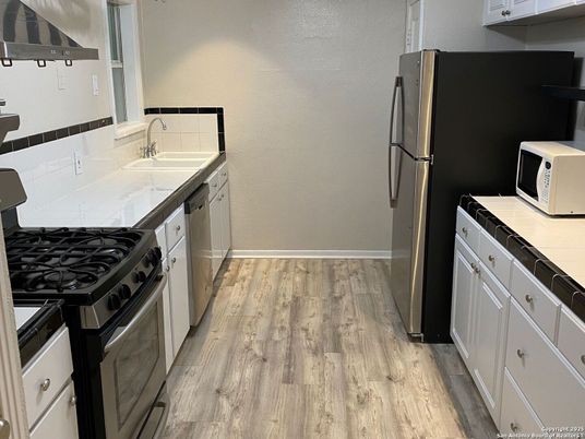 Interior, Kitchen, Tile Countertops, Wood Texture Flooring