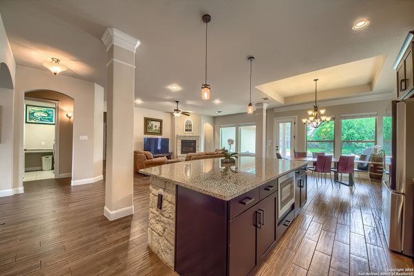 Chandelier, Dining room, Fireplace, Interior, Kitchen, Living room, Pendant Lights, Recessed Lighting, Wood Texture Flooring