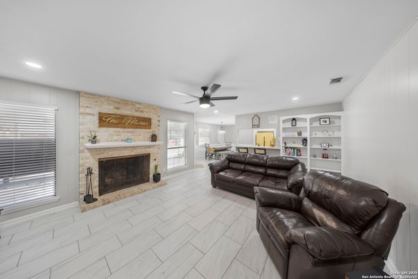 Fireplace, Interior, Living room, Recessed Lighting, Stone Walls, Wood Texture Flooring