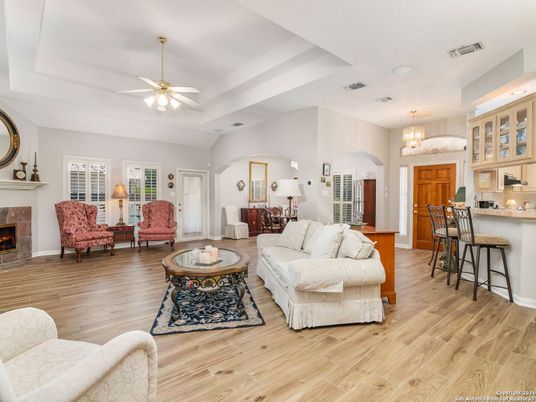Chandelier, Fireplace, Interior, Kitchen, Living room, Recessed Lighting, Wood Texture Flooring