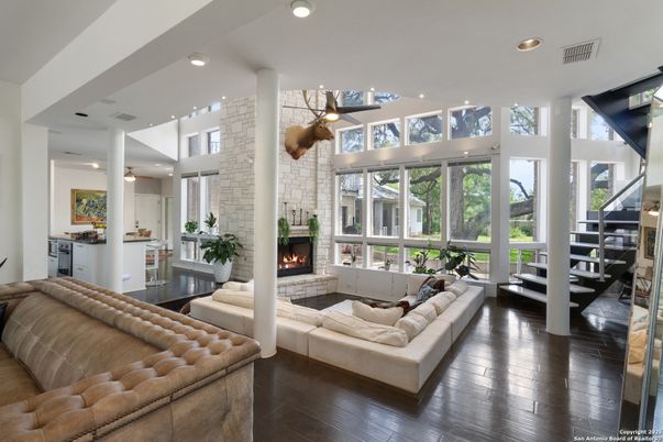 Fireplace, Interior, Living room, Recessed Lighting, Stone Walls, Wood Texture Flooring