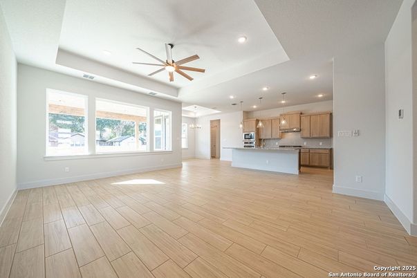 Empty room, Interior, Kitchen, Pendant Lights, Recessed Lighting, Stainless Steel Appliances, Wood Texture Flooring