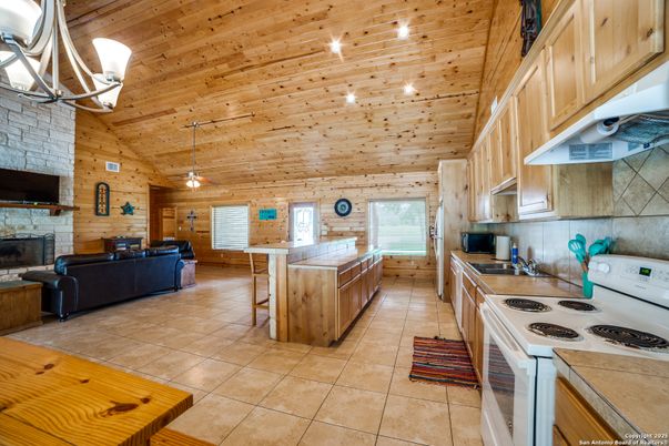 Fireplace, Interior, Kitchen, Living room, Pendant Lights, Stone Walls, Wooden Ceilings, Wooden Walls