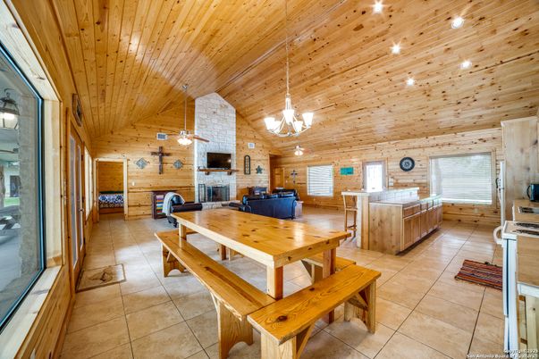 Dining room, Fireplace, Interior, Kitchen, Living room, Pendant Lights, Stone Walls, Wooden Ceilings, Wooden Walls