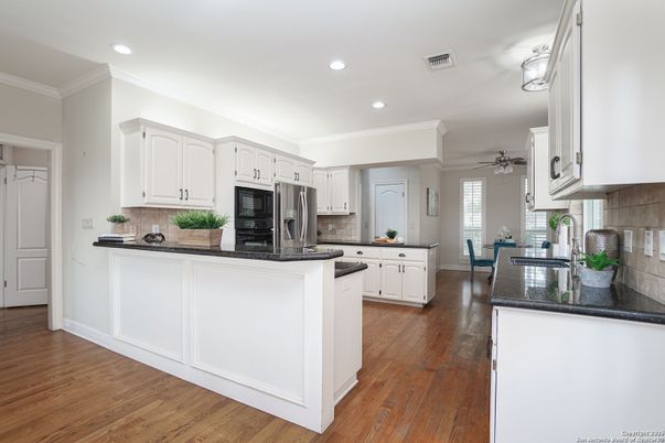Dining room, Interior, Kitchen, Recessed Lighting, Stainless Steel Appliances, Wood Texture Flooring