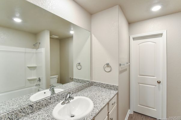 Bathroom, Dual Sink Vanities, Interior, Recessed Lighting, Wood Texture Flooring