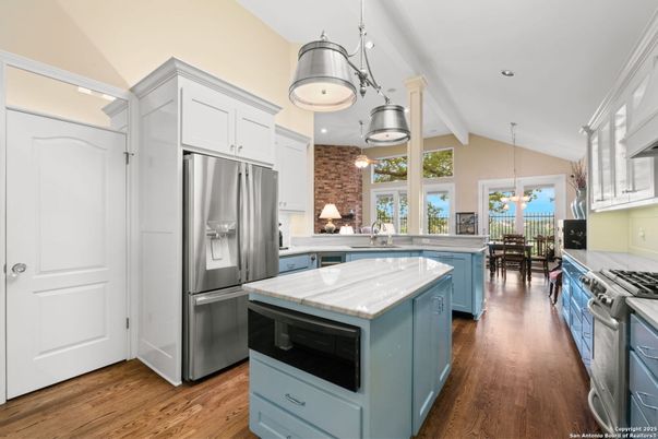 Dining room, Interior, Kitchen, Pendant Lights, Recessed Lighting, Stainless Steel Appliances, Stone Walls, Wood Texture Flooring