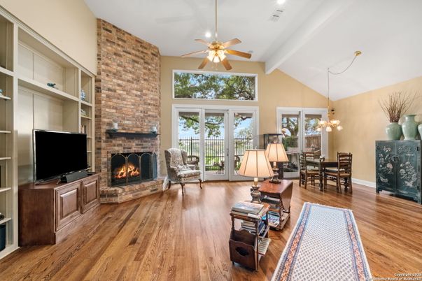 Chandelier, Dining room, Fireplace, Interior, Recessed Lighting, Stone Walls, Wood Texture Flooring