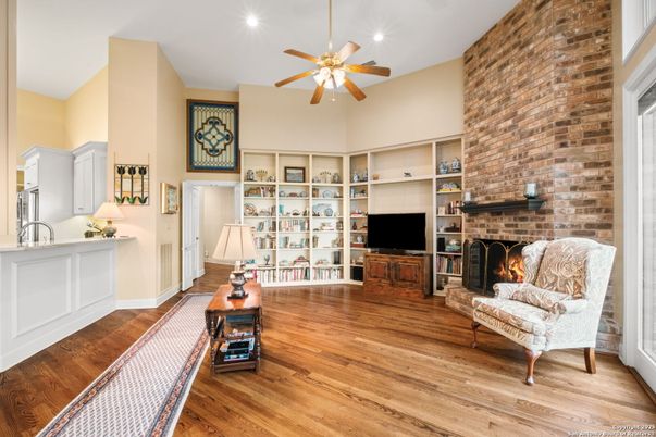 Fireplace, Interior, Living room, Recessed Lighting, Stone Walls, Wood Texture Flooring