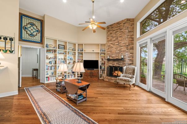 Fireplace, Interior, Living room, Recessed Lighting, Stone Walls, Wood Texture Flooring