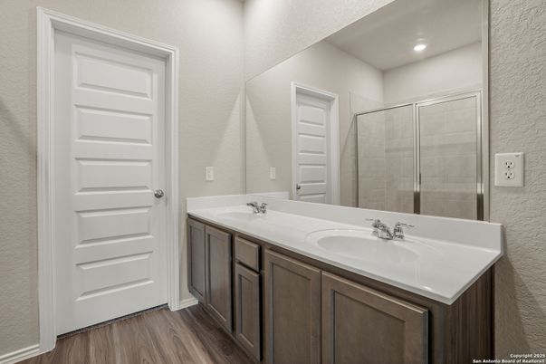 Bathroom, Dual Sink Vanities, Glass Shower, Interior, Recessed Lighting, Wood Texture Flooring