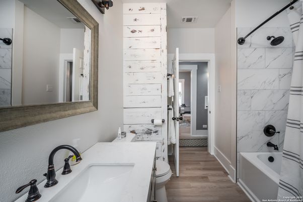 Bathroom, Dual Sink Vanities, Interior, Marble Walls, Wood Texture Flooring