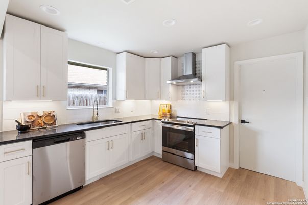 Interior, Kitchen, Recessed Lighting, Stainless Steel Appliances, Wood Texture Flooring