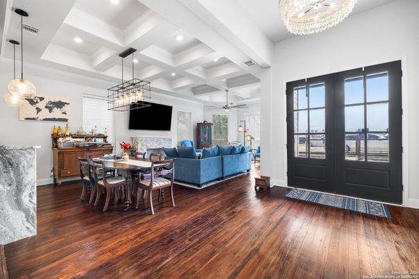 Chandelier, Dining room, Fireplace, Interior, Living room, Pendant Lights, Recessed Lighting, Wood Texture Flooring
