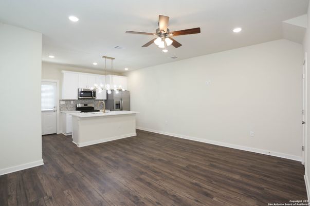 Empty room, Interior, Kitchen, Pendant Lights, Recessed Lighting, Stainless Steel Appliances, Wood Texture Flooring