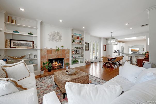 Dining room, Fireplace, Interior, Living room, Pendant Lights, Recessed Lighting, Wood Texture Flooring