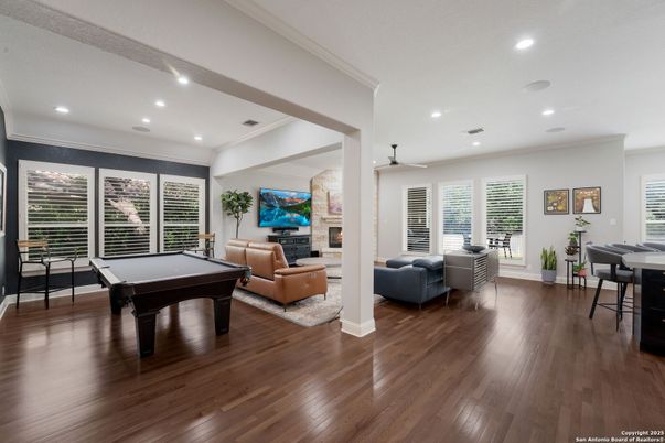 Billiard Table, Dining room, Fireplace, Game Room, Interior, Living room, Recessed Lighting, Wood Texture Flooring
