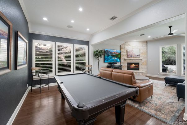 Billiard Table, Fireplace, Game Room, Interior, Living room, Recessed Lighting, Stone Walls, Wood Texture Flooring