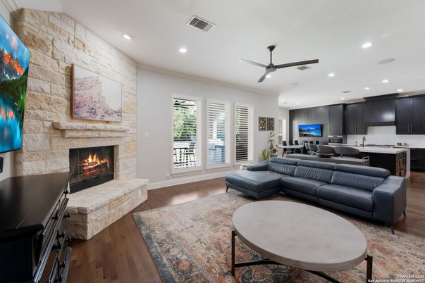 Fireplace, Interior, Kitchen, Living room, Recessed Lighting, Stone Walls, Wood Texture Flooring