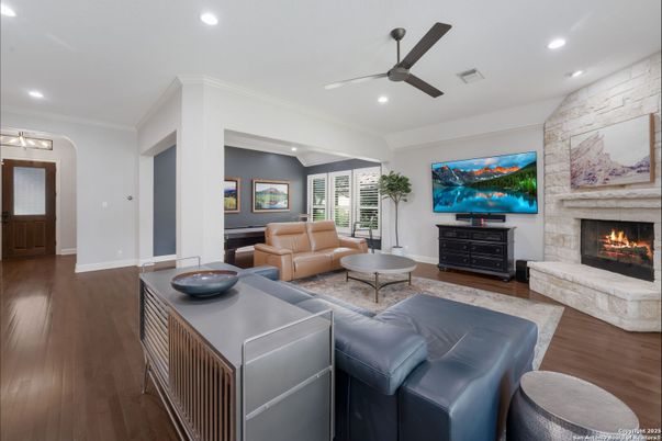 Fireplace, Interior, Living room, Recessed Lighting, Stone Walls, Wood Texture Flooring