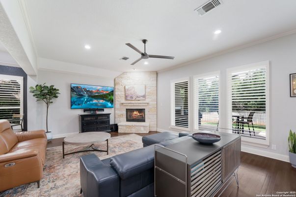 Fireplace, Interior, Living room, Recessed Lighting, Stone Walls, Wood Texture Flooring