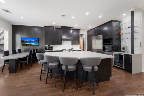 Dining room, Interior, Kitchen, Recessed Lighting, Stainless Steel Appliances, Wood Texture Flooring