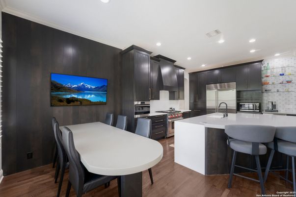 Dining room, Interior, Kitchen, Recessed Lighting, Stainless Steel Appliances, Wood Texture Flooring