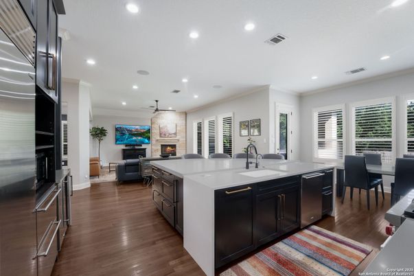 Dining room, Fireplace, Interior, Kitchen, Living room, Pendant Lights, Recessed Lighting, Stainless Steel Appliances, Wood Texture Flooring