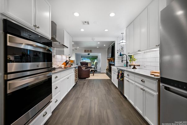 Dining room, Interior, Kitchen, Pendant Lights, Recessed Lighting, Stainless Steel Appliances, Wood Texture Flooring