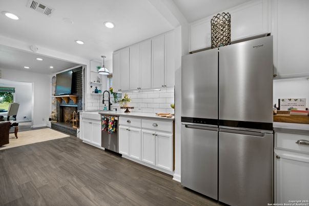 Fireplace, Interior, Kitchen, Recessed Lighting, Stainless Steel Appliances, Wood Texture Flooring