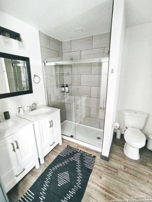 Bathroom, Dual Sink Vanities, Glass Shower, Interior, Wood Texture Flooring