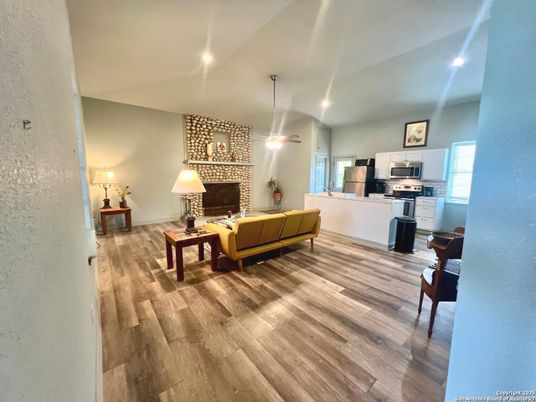 Fireplace, Interior, Kitchen, Living room, Pendant Lights, Piano, Recessed Lighting, Wood Texture Flooring